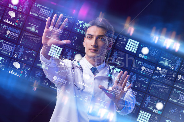 Stock photo: Concept of telemedicine with male doctor