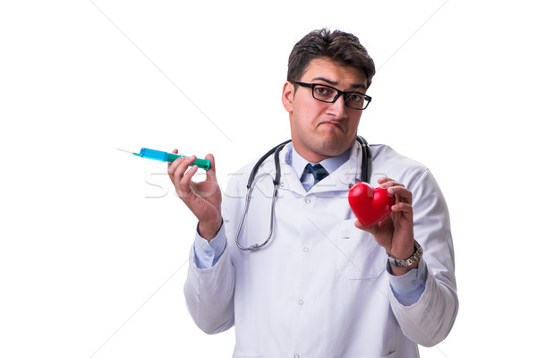 Young male cardiologist doctor holding a heart isolated on white Stock photo © Elnur