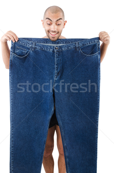 Man in dieting concept with oversized jeans Stock photo © Elnur