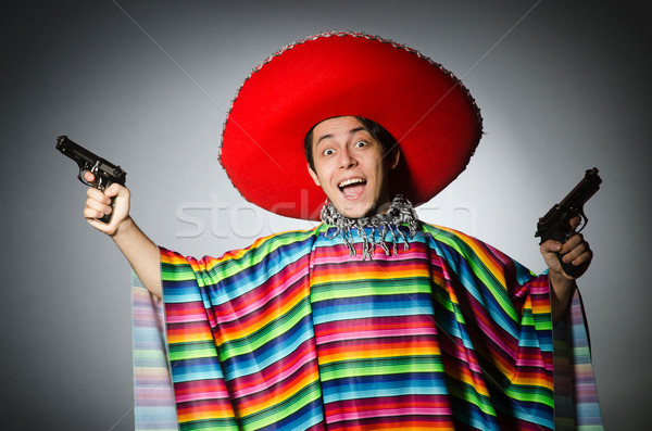 Férfi élénk mexikói tart kézifegyver szürke Stock fotó © Elnur