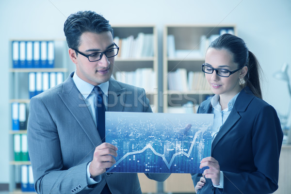 Business people discussing stock chart trends Stock photo © Elnur