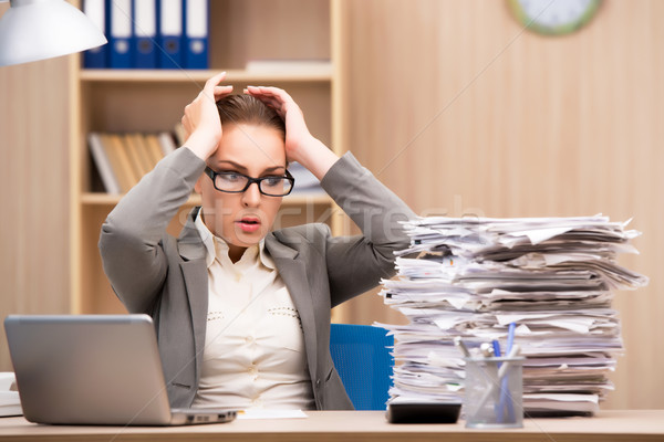 Businesswoman under stress from too much work in the office Stock photo © Elnur