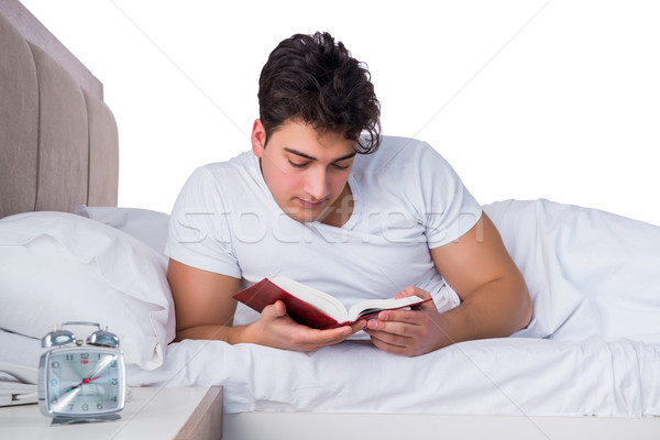 Foto stock: Homem · cama · sofrimento · insônia · livro · relógio