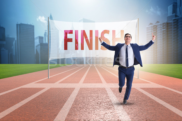 Businessman on the finishing line in competition concept Stock photo © Elnur