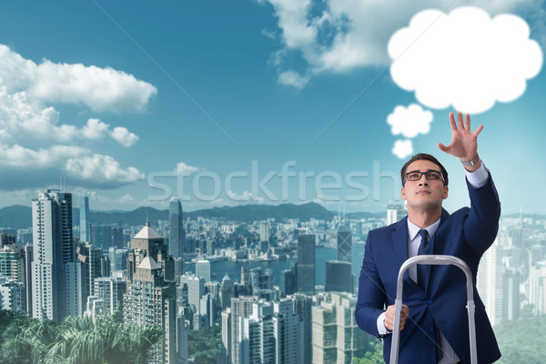 Businessman reaching out to callout message Stock photo © Elnur