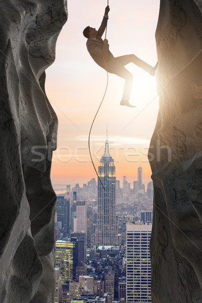 Businessman overcoming challenges in business concept Stock photo © Elnur