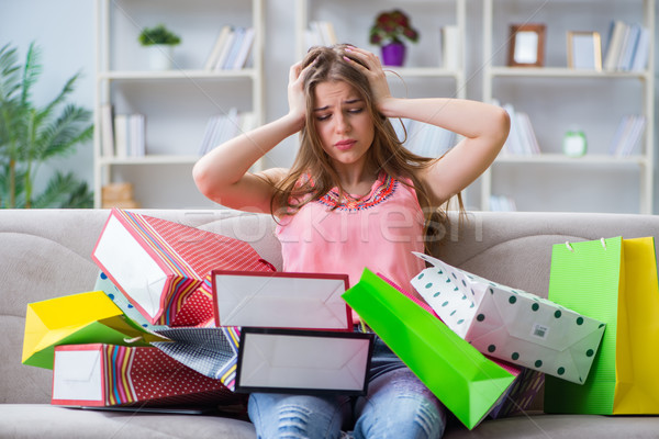 The young woman with shopping bags indoors home on sofa Stock photo © Elnur
