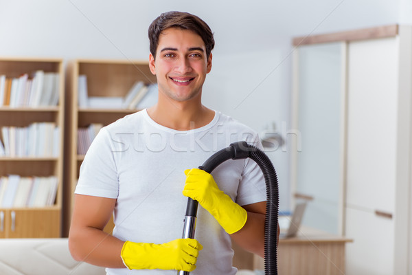 Man husband cleaning the house helping wife Stock photo © Elnur