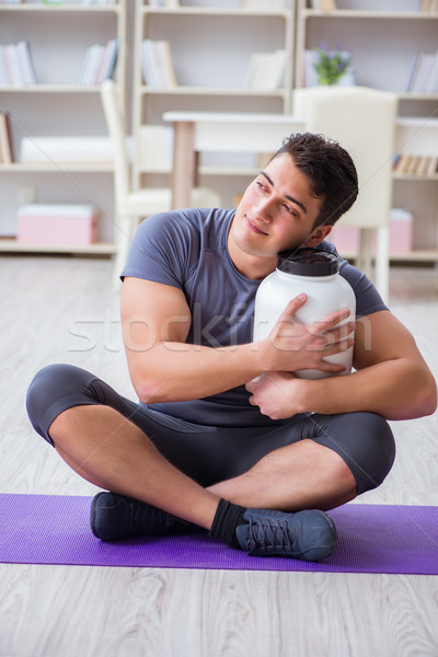 Man with food supplements in sports and healthy lifestyle concep Stock photo © Elnur