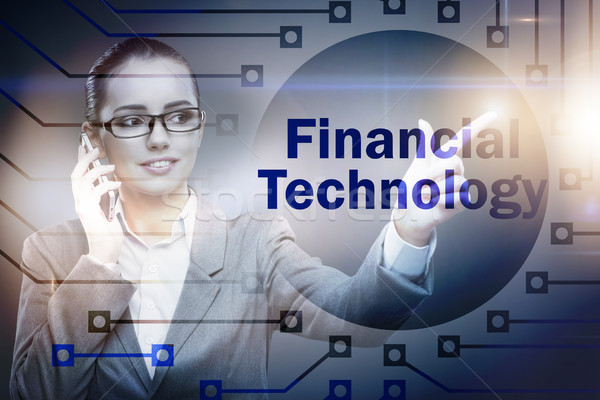 Stock photo: Businesswoman pressing buttons in fintech concept