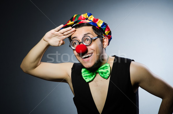 Funny clown against the dark background Stock photo © Elnur