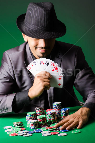 Homme jouer sombre casino vert costume [[stock_photo]] © Elnur