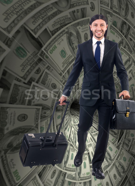 Businessman fighting against dollar funnel Stock photo © Elnur