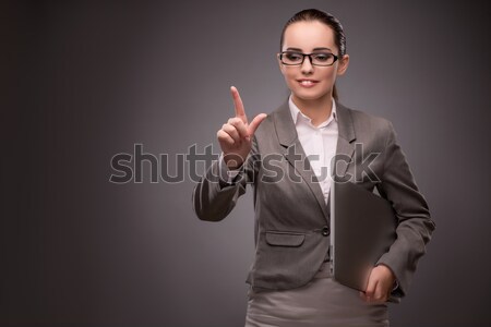 Young businesswoman pressing virtual button Stock photo © Elnur