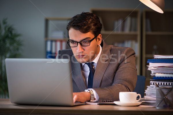 Businessman staying in the office for long hours Stock photo © Elnur