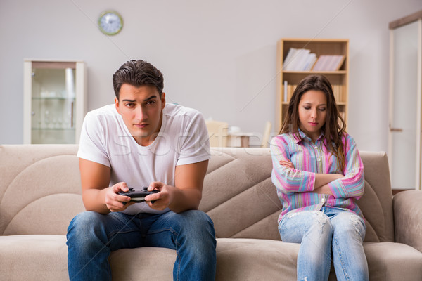 Young family suffering from computer games addiction Stock photo © Elnur