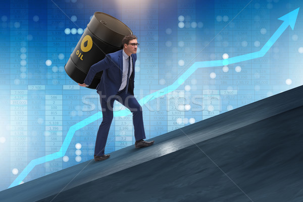 The businessman under the burden of oil barrel Stock photo © Elnur