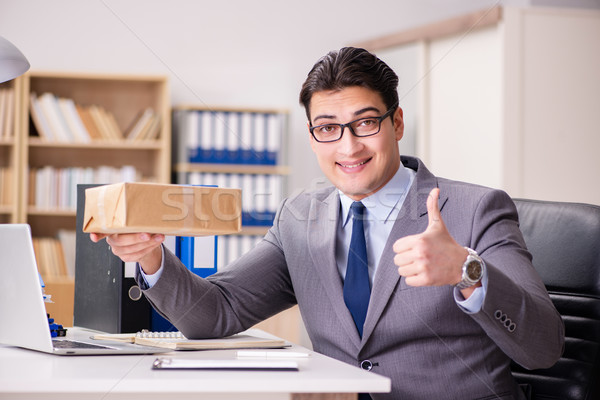 Businessman receiving parcel in the office Stock photo © Elnur