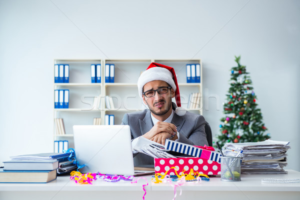 Stock photo: Young businessman celebrating christmas in the office