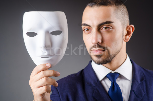 Man with mask in the dark Stock photo © Elnur