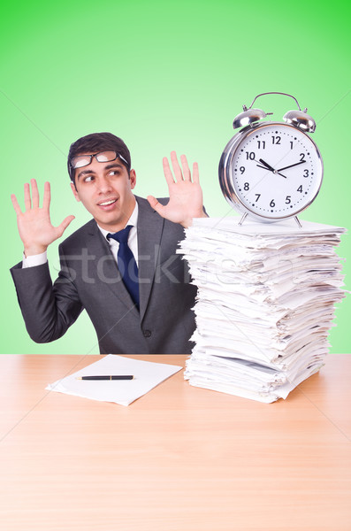 Woman businessman with giant alarm clock Stock photo © Elnur