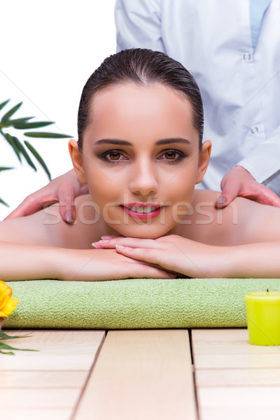 Woman during massage session in spa salon Stock photo © Elnur