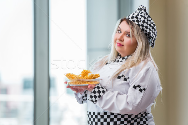 Woman cook working in the bright kitchen Stock photo © Elnur