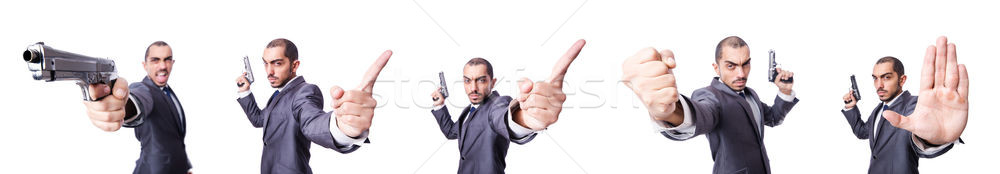 Stock photo: Businessman with gun isolated on white