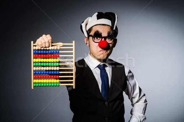 Stock photo: Funny clown with abacus in accounting concept