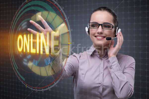 Businesswoman pressing virtual button online Stock photo © Elnur