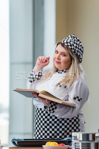 The young chef cook working in the kitchen Stock photo © Elnur