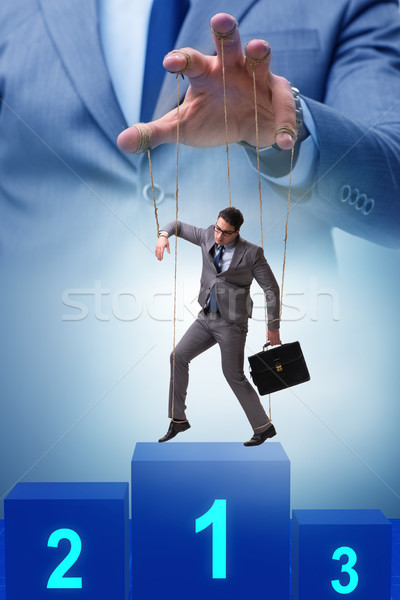 Stock photo: Businessman puppet being manipulated by boss