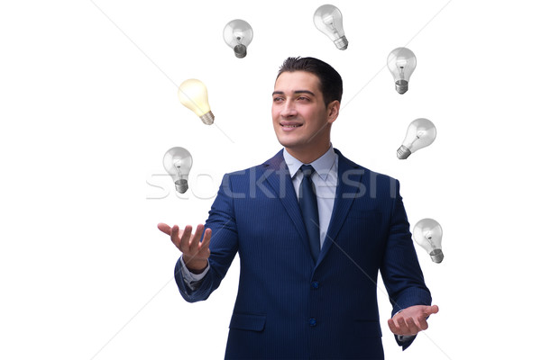 Businessman juggling lightbulbs in new idea concept Stock photo © Elnur