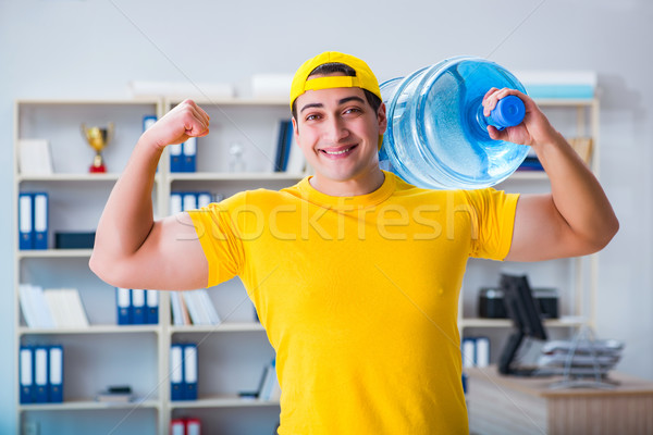 The man delivering water bottle to the office Stock photo © Elnur