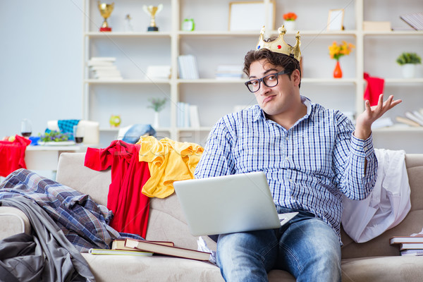 Stock photo: The young man working studying in messy room