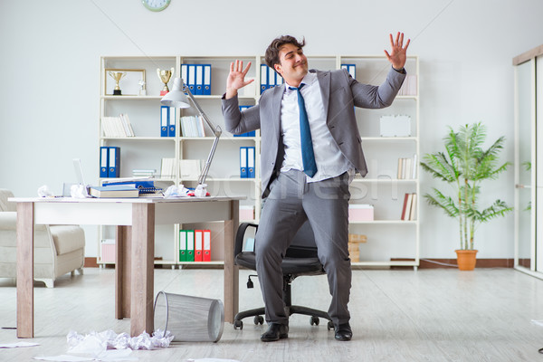 Stock photo: Businessman having fun taking a break in the office at work