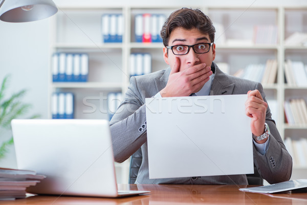 The businessman  in office holding a blank message board Stock photo © Elnur