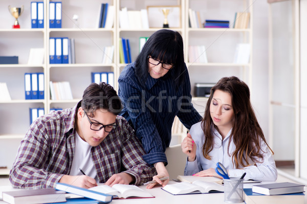 Young student and teacher during tutoring lesson Stock photo © Elnur