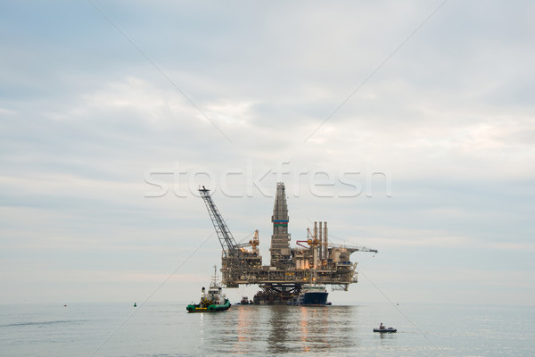 Oil rig being tugged in the sea Stock photo © Elnur