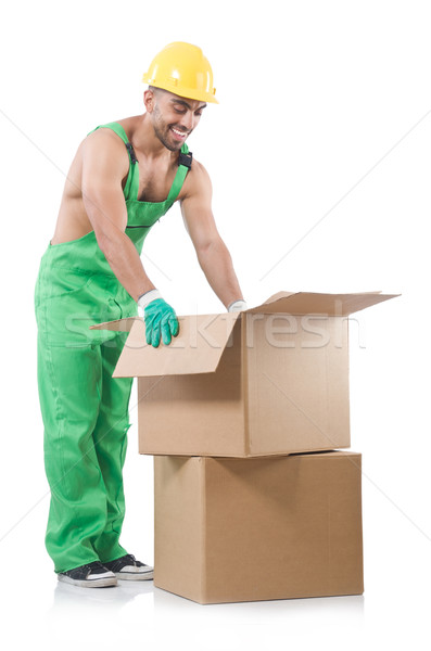 Man in green coveralls with boxes Stock photo © Elnur