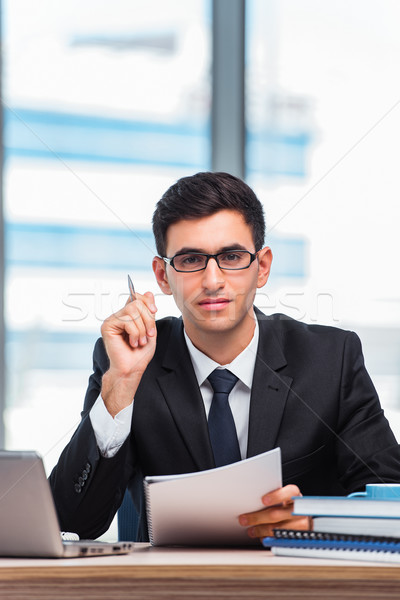 Young businessman working in the office Stock photo © Elnur
