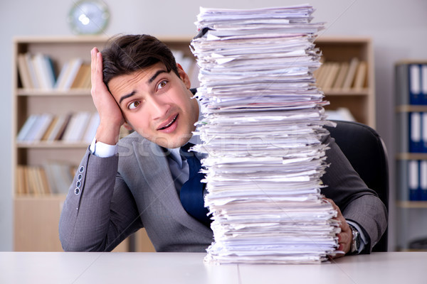 Businessman struggling to meet challenging deadlines Stock photo © Elnur