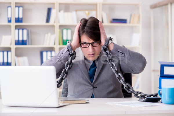 Stock photo: The businessman tied with chains to his work