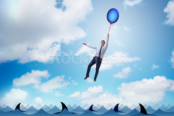 Businessman flying holding balloon Stock photo © Elnur