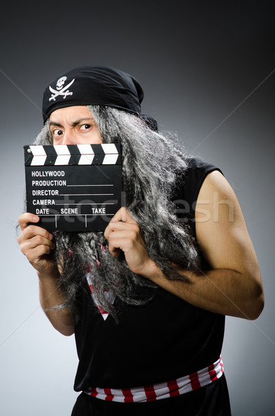 Old pirate with movie board Stock photo © Elnur