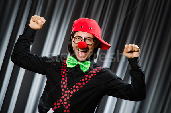 Stock photo:  Funny clown in humorous concept against curtain