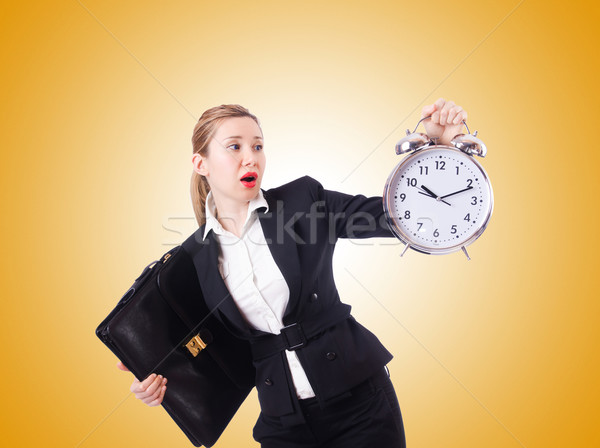 Woman businesswoman with giant clock Stock photo © Elnur