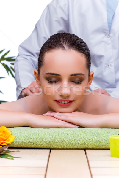 Woman during massage session in spa salon Stock photo © Elnur