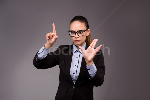 Young woman businesswoman pressing virtual buttons Stock photo © Elnur
