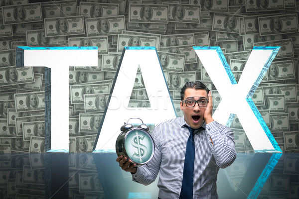 Businessman fearful of high taxes Stock photo © Elnur